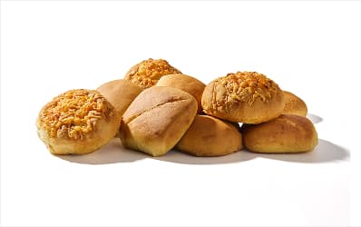 A pile of potato and sourdough buns.
