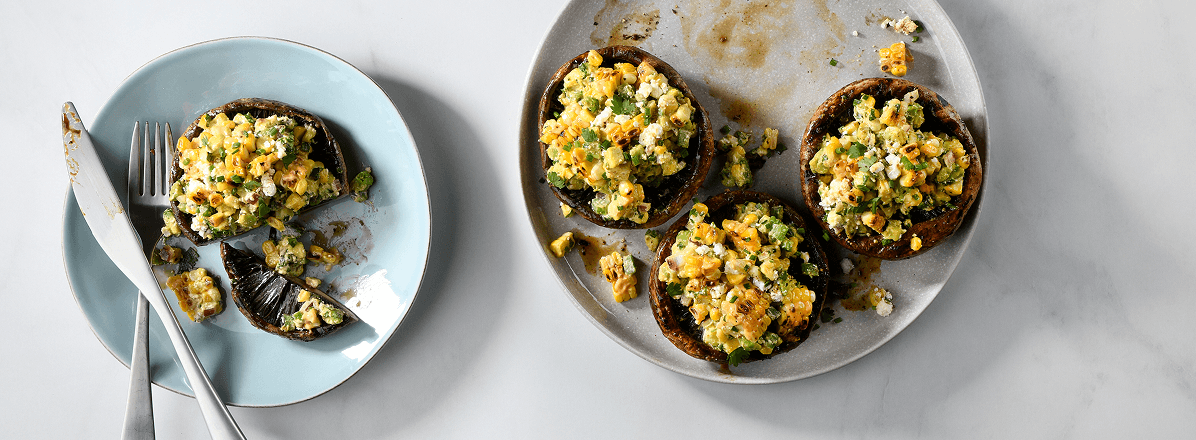 Overhead shot of grilled street corn and avocado salad
