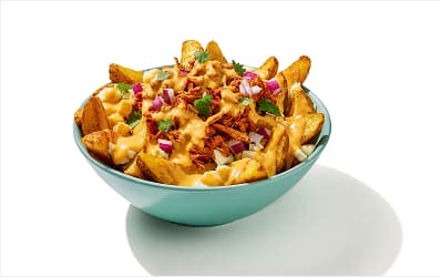 Potato wedges topped with cheese curds, queso, al pastor, red onion, and cilantro.