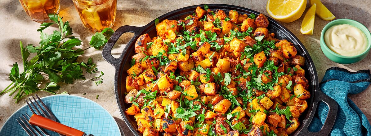 Overhead shots skillet potatoes topped with parsley