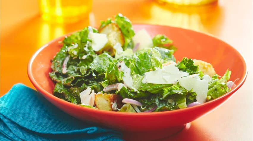 /content/dam/empire/sobeys/assets/articles/compliments/Orange-surface-with-bowl-of-caesar-salad.jpg