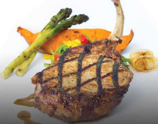 Caribbean-spiced Nagano pork chops with honey and cider vinegar sauce