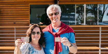 people holding Sobeys gift cards in front of Sobeys food truck