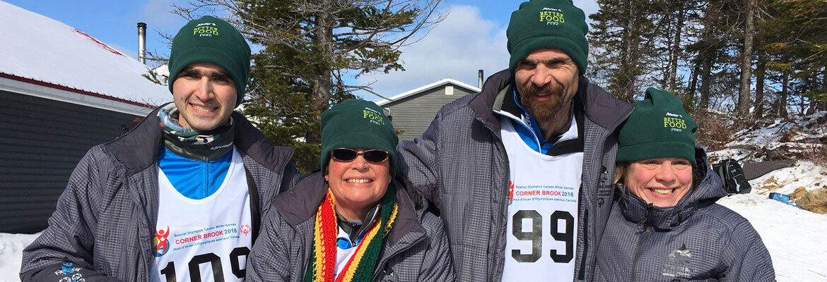 People wearing Sobeys Better Food Fund Winter Hats outside and smiling at the camera together