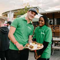 Sobeys employees holding tray of sliders