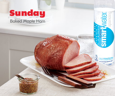 meal-8 Sunday. Baked Maple Ham plate shown with container of mustard, as well as a glass and bottle of sparkling smartwater