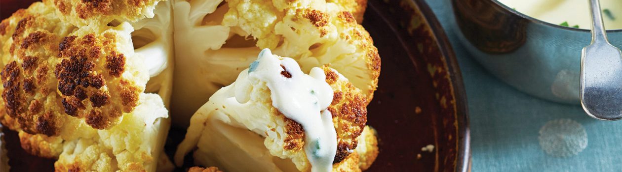 Whole Roasted Cauliflower with Cheddar Sauce