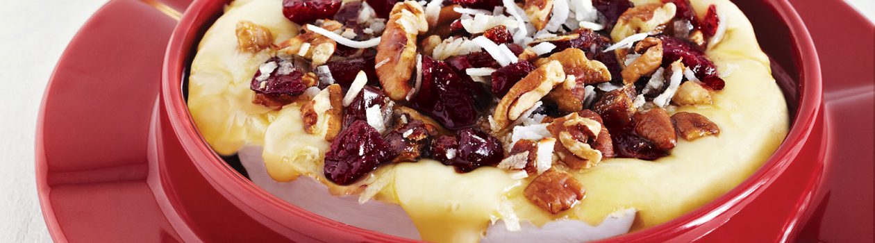 Warm Brie Topped with Dried Fruit, Pecans & Coconut
