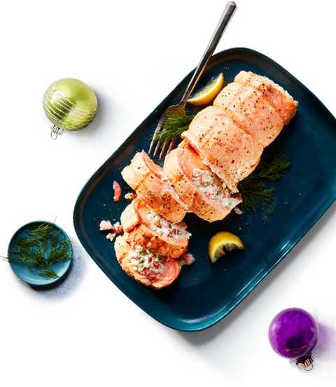 seafood Rolled roasted salmon on a blue platter.