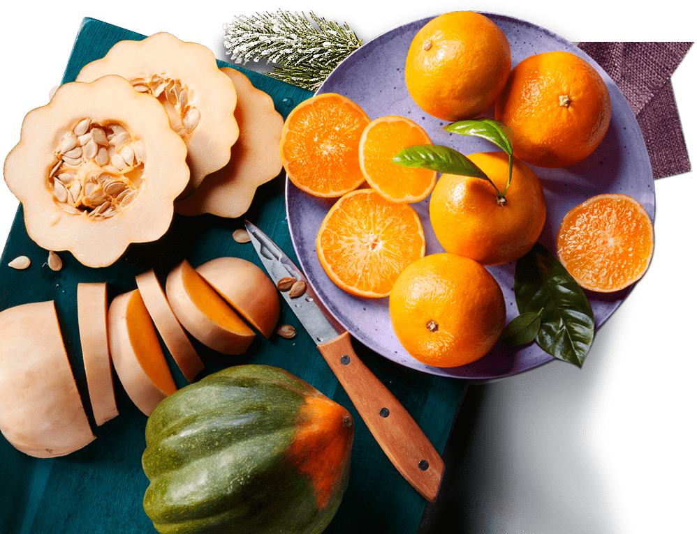 squash-101 Sliced squash and citrus fruit on a board.