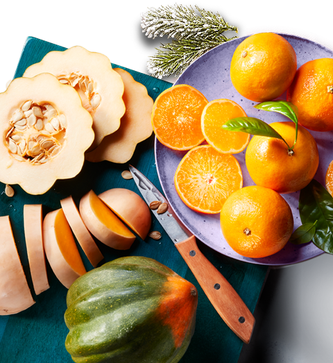 squash_image Sliced squash and citrus fruit on a board.