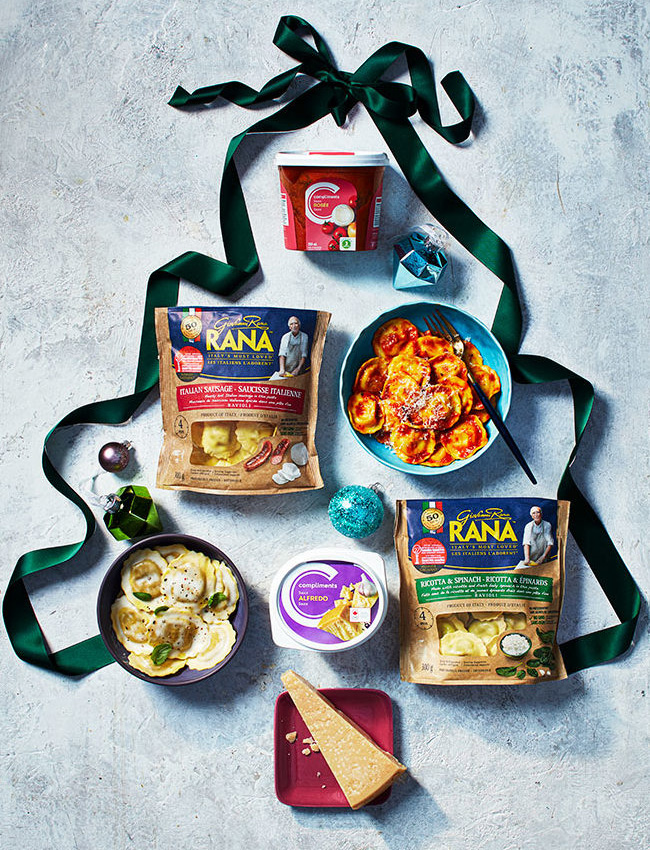 flat-lay of pasta sauces and pastas inside a ribbon christmas tree outline