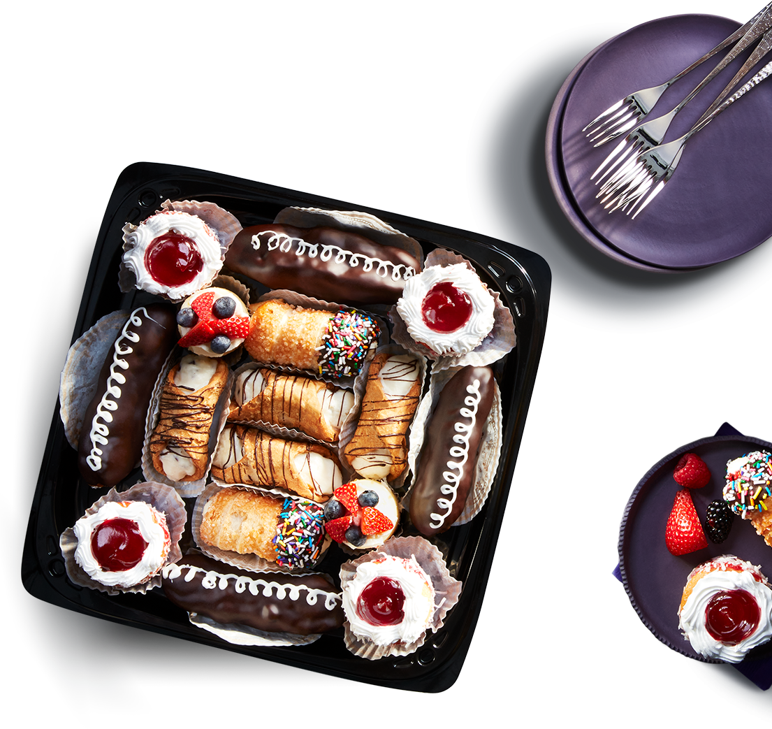 try-me-dish Arranged fruit, cheese, and pastry trays on tabletop.