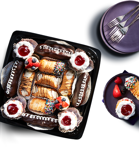 tryme-dish Arranged fruit, cheese, and pastry trays on tabletop.