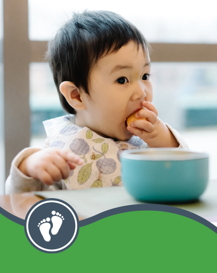 baby_led_weaning Child feeding themselves at a table