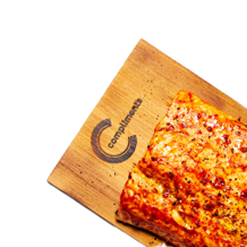 Shot of a cedar planked, cooked Atlantic Salmon filet with a marinade glaze on top