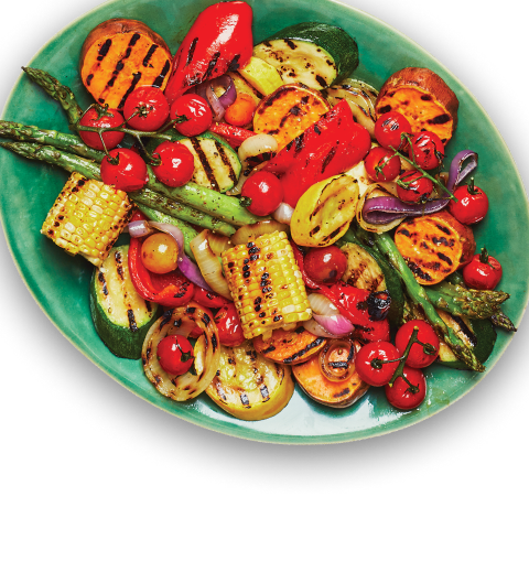 Grilled_vegetables Various grilled vegetables, including asparagus, corn, and zucchini, on a green platter.