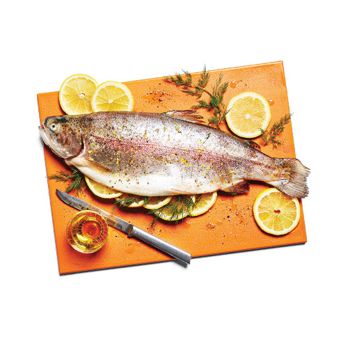 Lemon and dill stuffed whole trout, cooked.