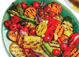 Close-up of grilled slices of zucchini and peppers glazed with soy and Worcestershire sauce.