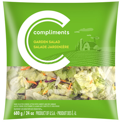 A clear plastic bag of Compliments Garden Salad Mix with a green label.