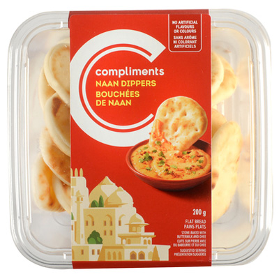 A Compliments Naan Dippers package with an orange label depicting the mini naan breads getting dipped into a spread.