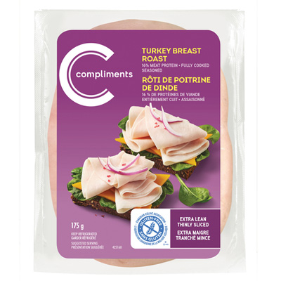 Compliments extra-lean turkey slices in a clear plastic container with a purple Compliments sticker and an image of an open-face turkey sandwich.
