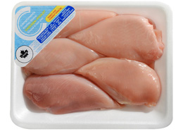Value-size chicken breasts in a white tray with a blue Compliments label on it.