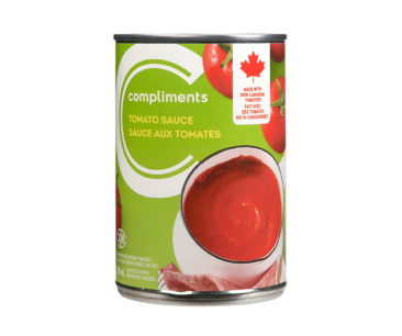 Green and white lined tin can of Compliments tomato sauce.

