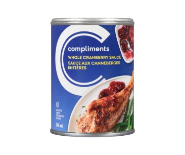 Blue paper lined tin can of Compliments whole cranberry sauce. 
