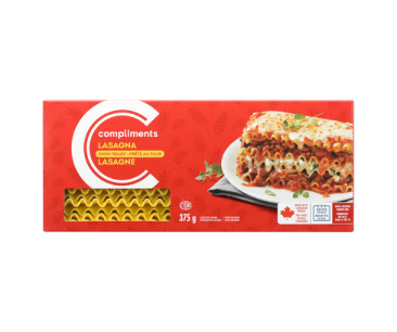 Red cardboard box  of Compliments Oven-Ready Lasagna noodles with image of a slice of layered lasagna. 
 