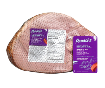 Whole hickory smoked honey spiral ham in a cryovac package with a purple Panache label on the front.
