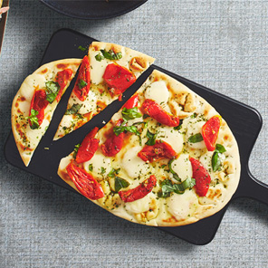  Margherita topped flatbread with tomatoes, cheese and basil.