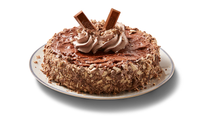 Chocolate single layer cake covered in KitKat crumbs on the side, topped with chocolate icing, and pieces of the candy bar.
