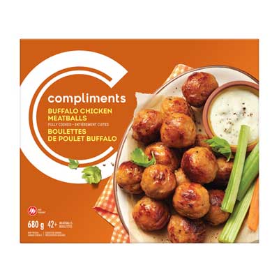 orange box with plate of meatballs, bowl of dipping sauce, and celery sticks