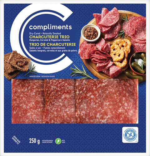 Clear plastic package of Compliments Charcuterie Trio (Hungarian, Cervelat and Peppercorn) with blue label.
