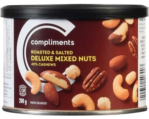 Tin with a brown label of Compliments Deluxe 40% Roasted Cashews Mixed Nuts depicting various nuts on the label.
