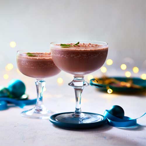 Martini glasses filled with frosty Panache Mistletoe Wish Ice Cream, vodka and milk, plus grated chocolate on top.