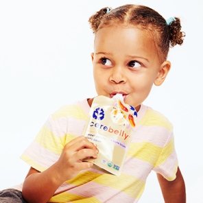 Young girl eating a Cerebelly bone broth puree