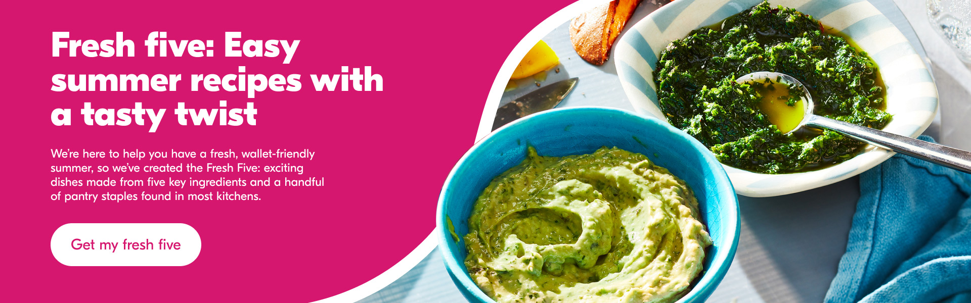 Two blue bowls of sauce including an avo tahini sauce and a fresh summer green herb sauce on a gray tray.