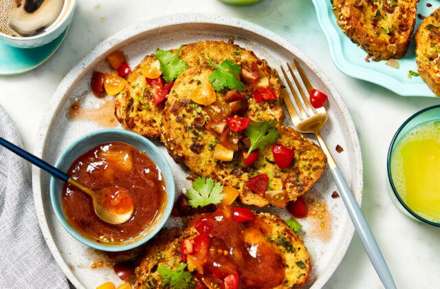 Savoury French toast slices on a beige plate topped with fresh cherry tomato salsa.