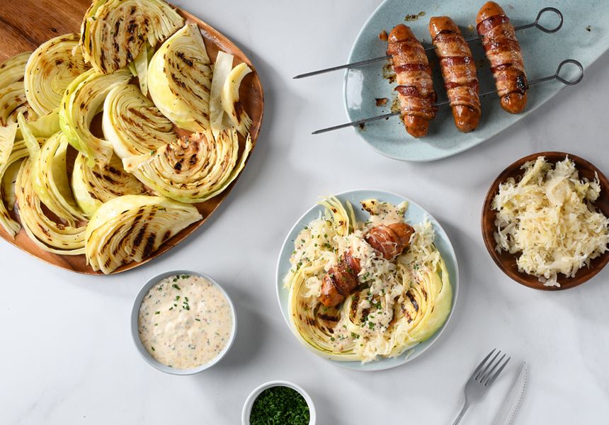 Bacon Wrapped Sausages with Grilled Cabbage and Sauerkraut Slaw