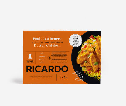 Orange cardboard box with image of Butter Chicken on black plate on front.