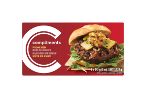 A burgundy box of Compliments Prime Rib Beef Burgers with a photograph of a dressed burger on the front of the package.