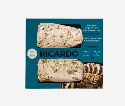 Blue cardboard packaging with two portions of Cryovac-wrapped Mediterranean Style Chicken Breasts peering through the blue windows.