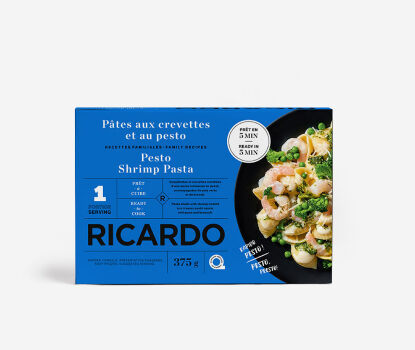 Blue cardboard box with image of Pesto Shrimp Pasta on a black plate on front.