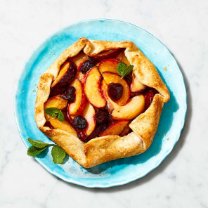 Turquoise plate topped with a stonefruit galette made with a Compliments deep dish pie shell.