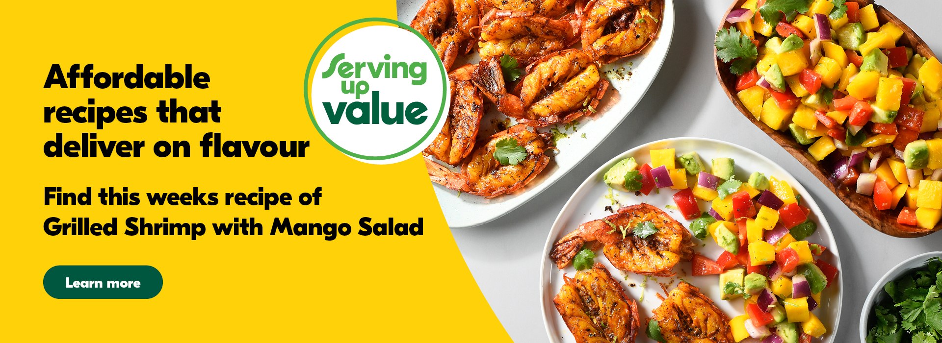 White plate with grilled shrimp and diced up mango, avocado, red pepper and red onion on the side; sprinked with cilantro. Surrounded by a white plate with grilled shrimp, a wooden bowl with mago salad and a small white bowl with cilantro.