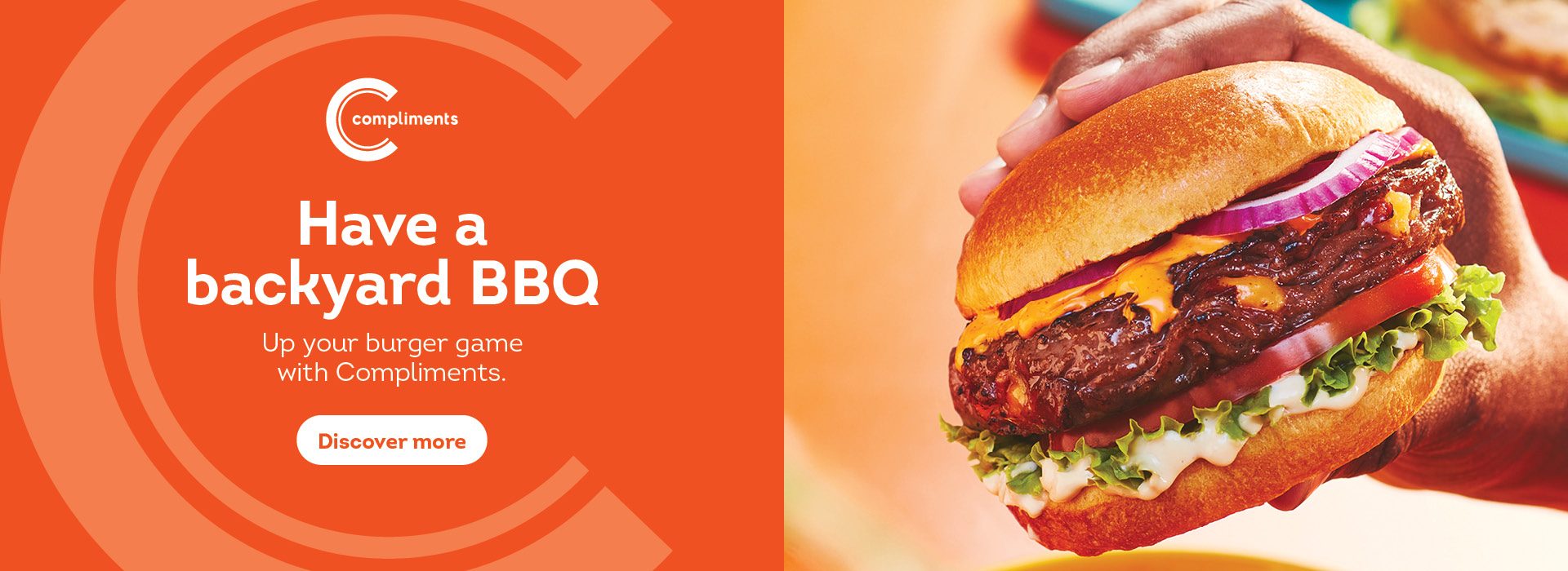 Text Reading "Have a Backyard BBQ. Up your burger game with Compliments.Click on 'Discover More' Button to learn more" On the right side, a hand is shown holding a large hamburger.