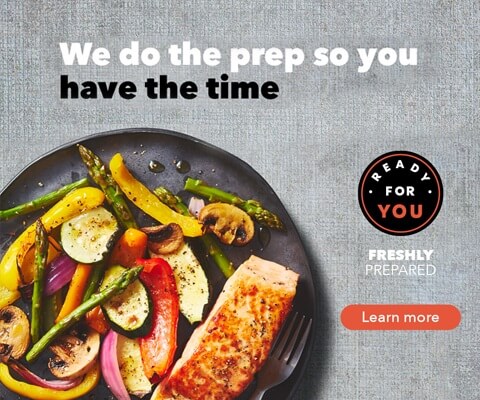 An image of prepared food on a black plate with the text "We do the prep so you have the time." Click on "learn more" for more info.