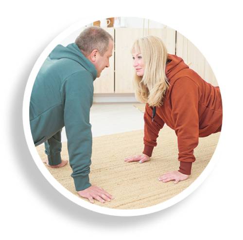 Couple doing push-ups together realize physical activity is one of the essentials of diabetes care